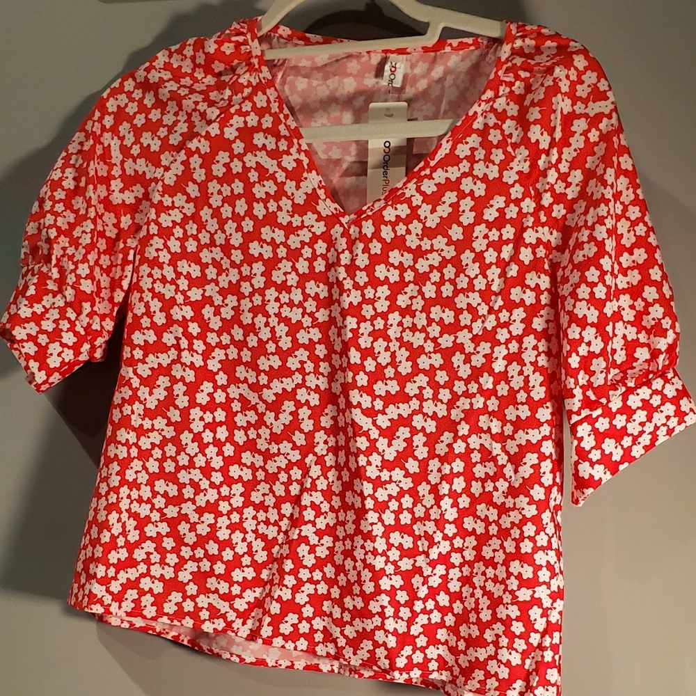 Red and white floral blouse
